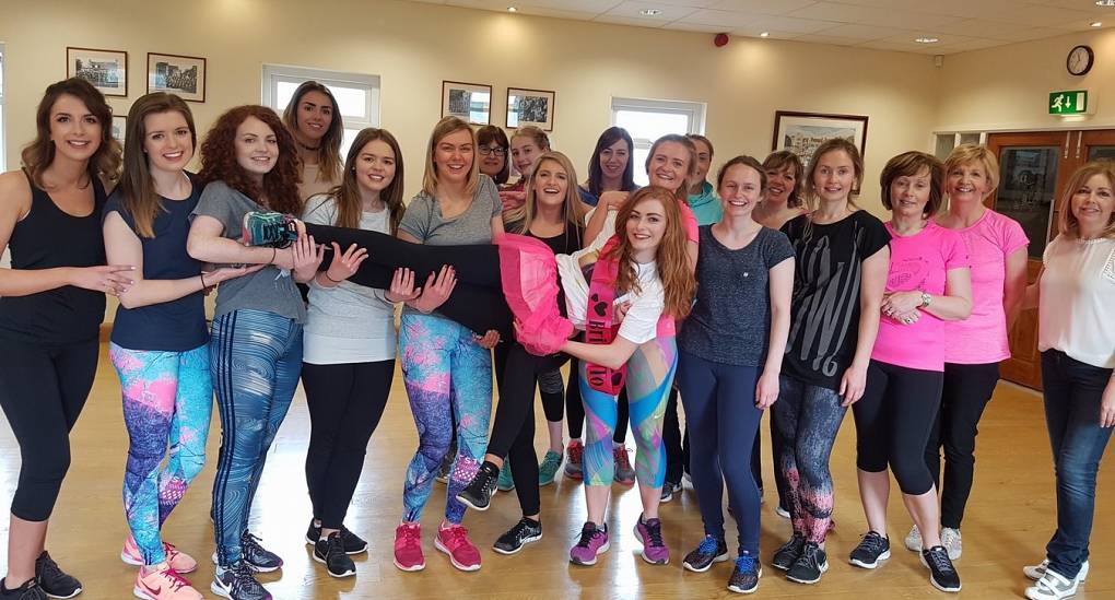Hens pose for group picture after dance workshop